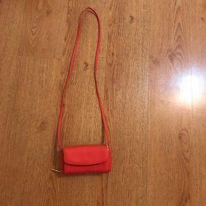 It is a wallet but you cane make it a purse